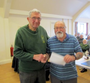 Bert gave Alan a voucher for his work in preparing the hall each club day
